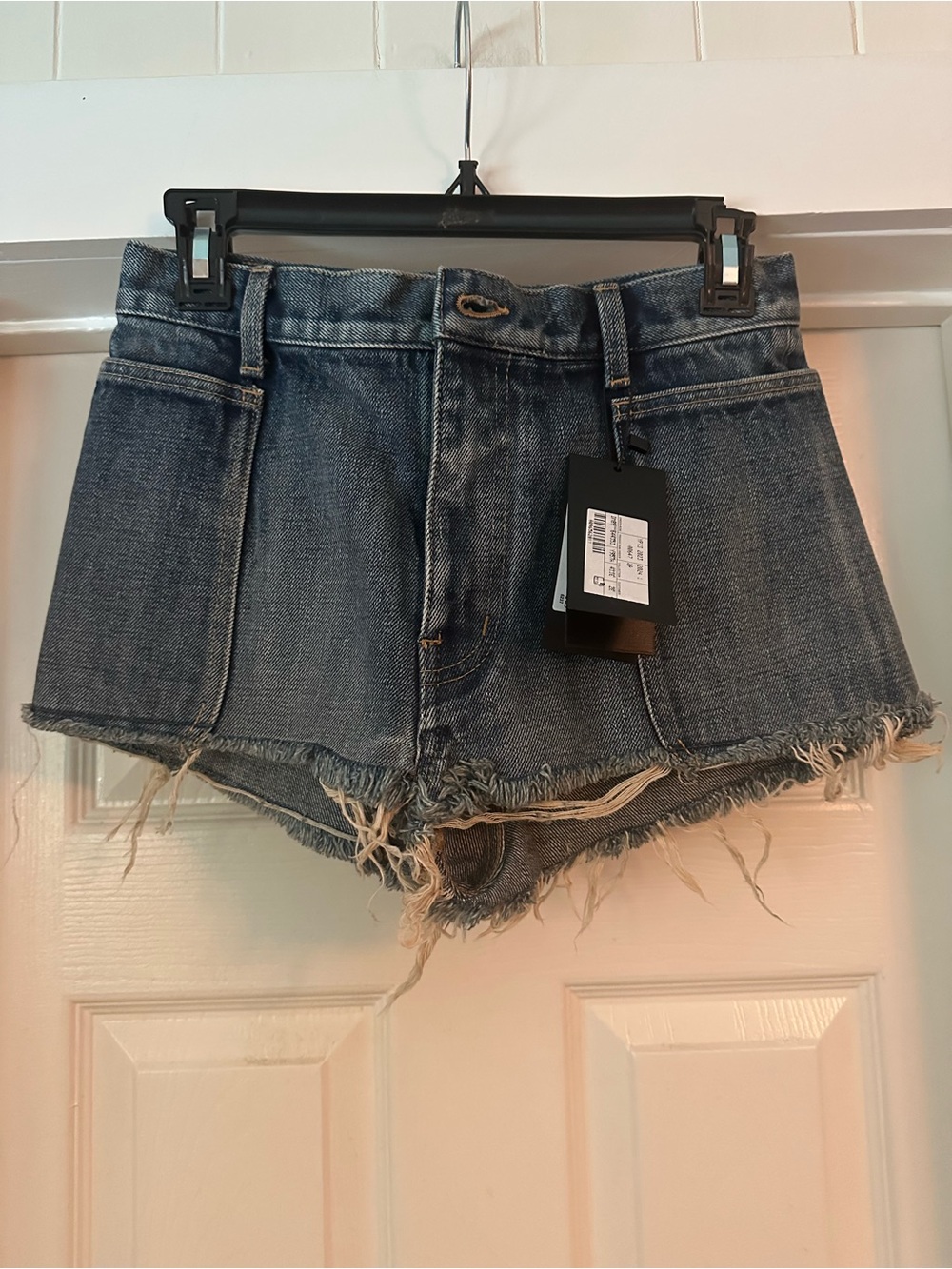 Saint Laurent Distressed Denim Cutoff Shorts in Blue